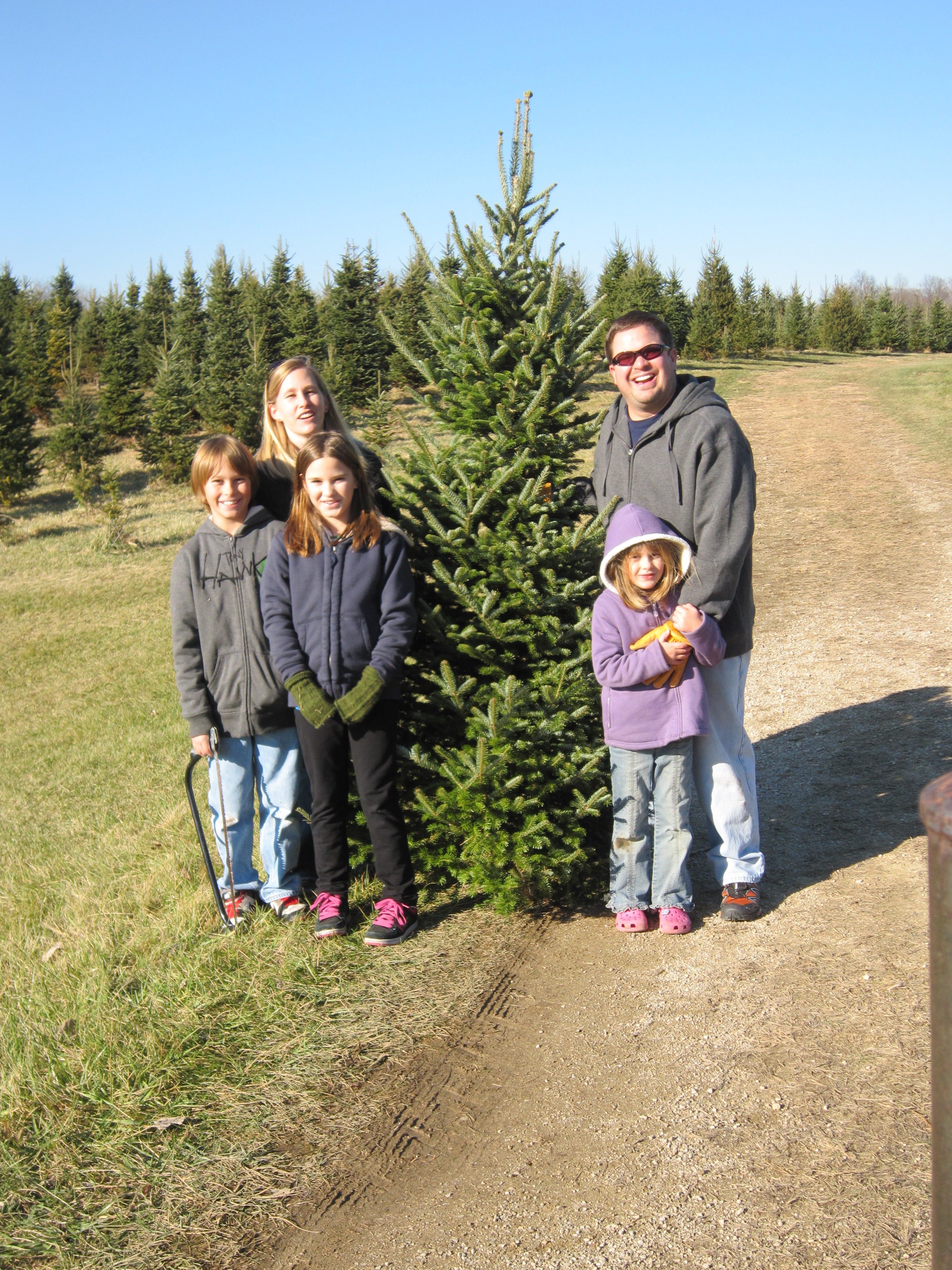 Customers with a freshly cut Christmas tree
